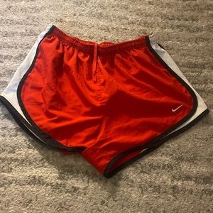 Nike red, white, and black shorts, size medium